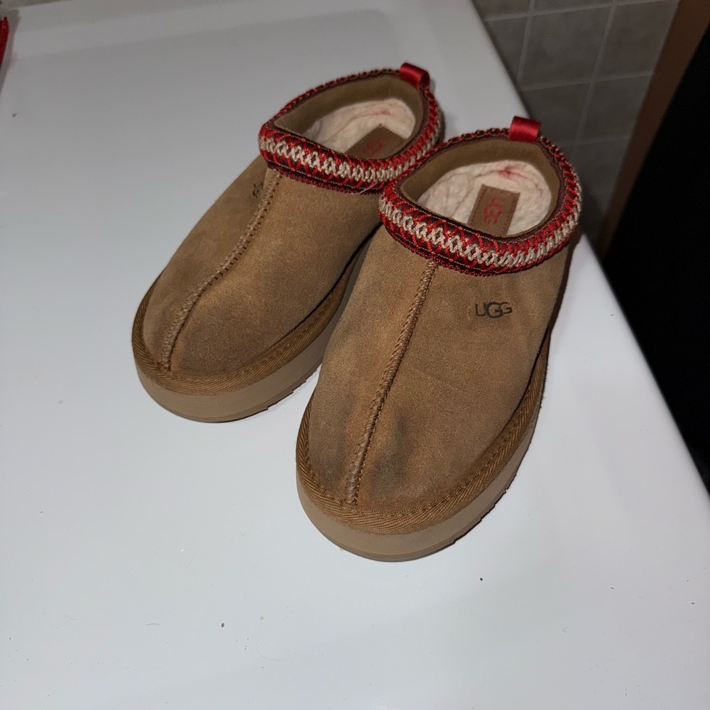 UGG Tan Suede Slip-Ons with Red Trim